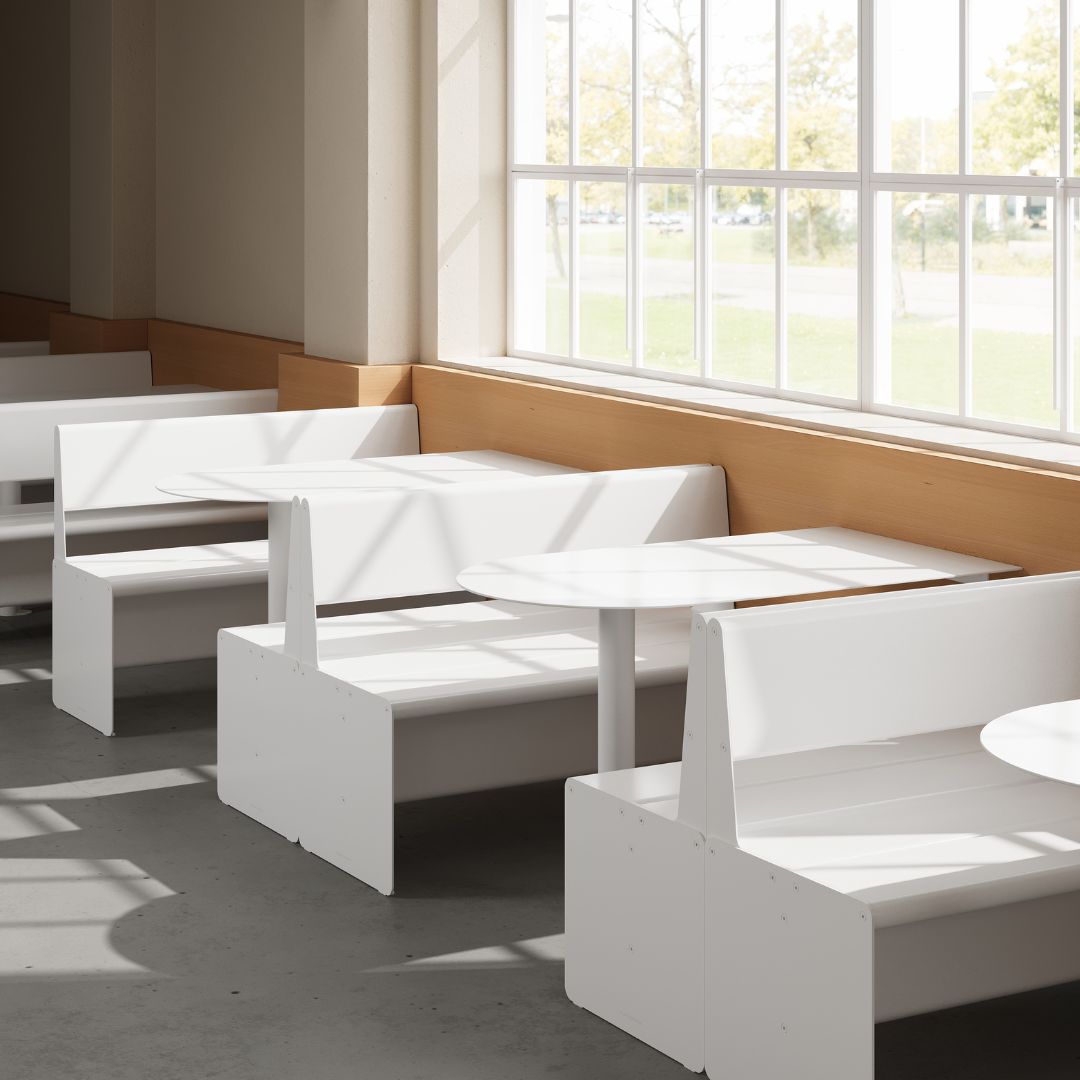 multiple white booth seats installed to create multiple booths in a cafe