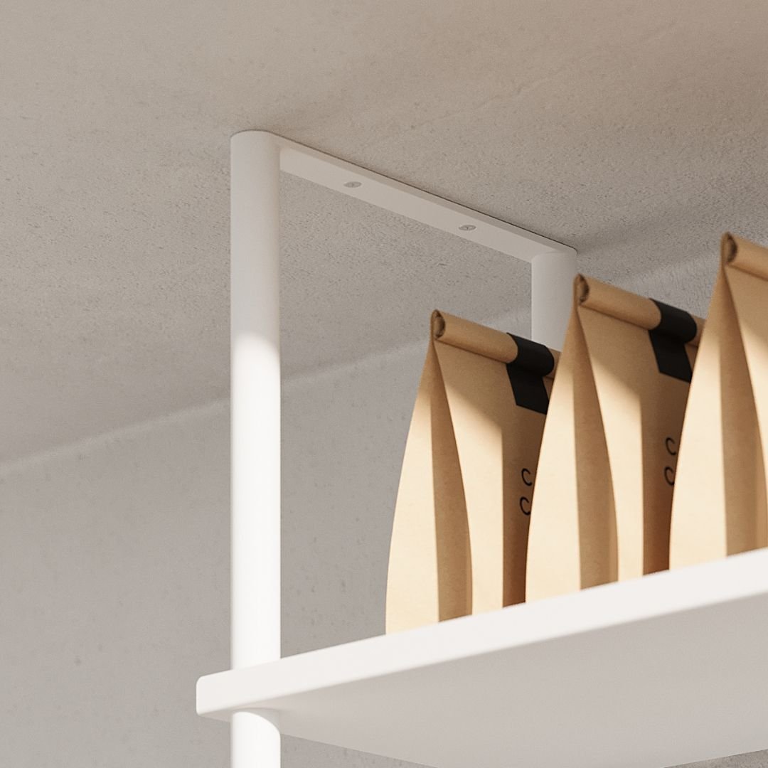 closer up of white ceiling mounted shelves holding coffee bean bags