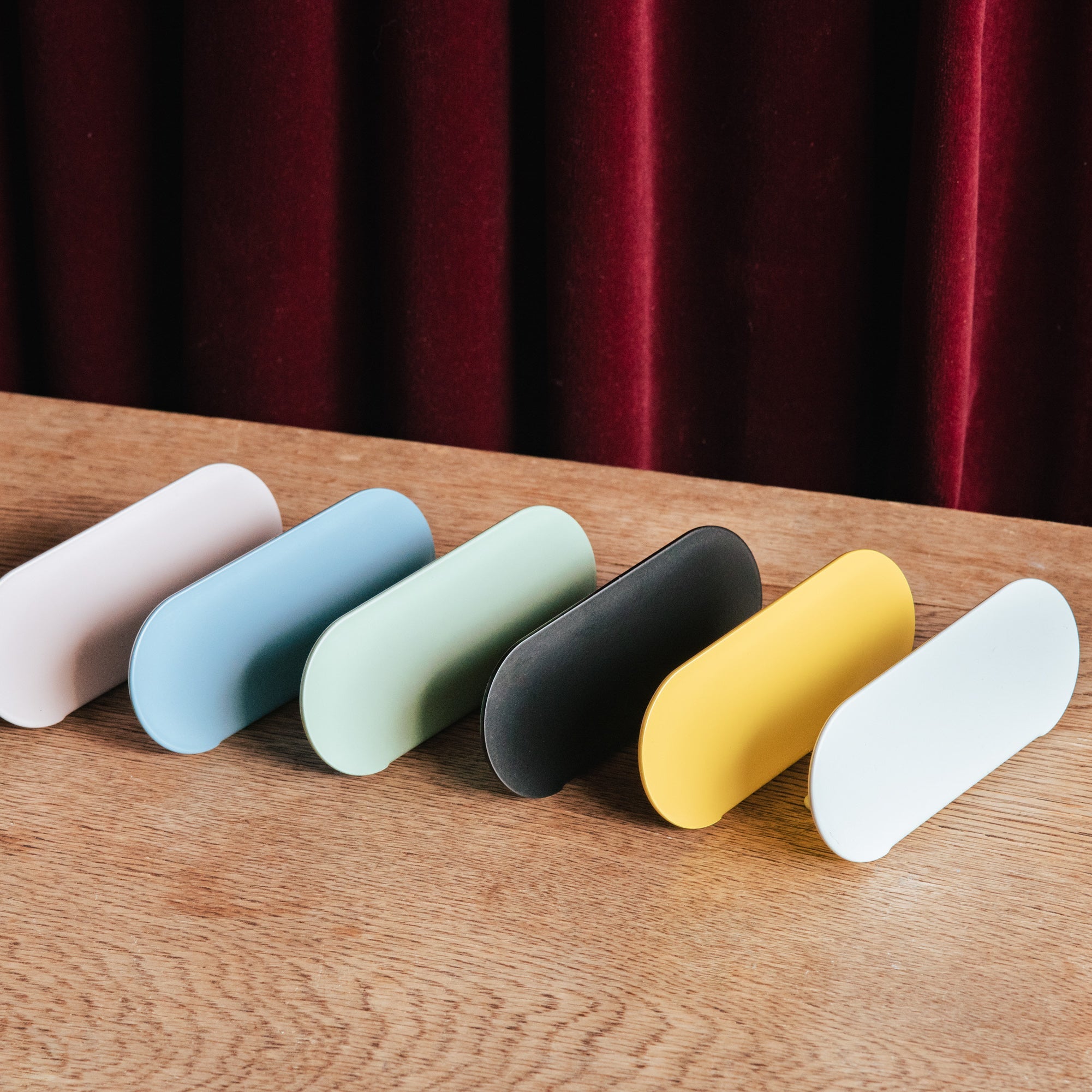 a line up of all the coloured curve counter retail tag signs in front of each other