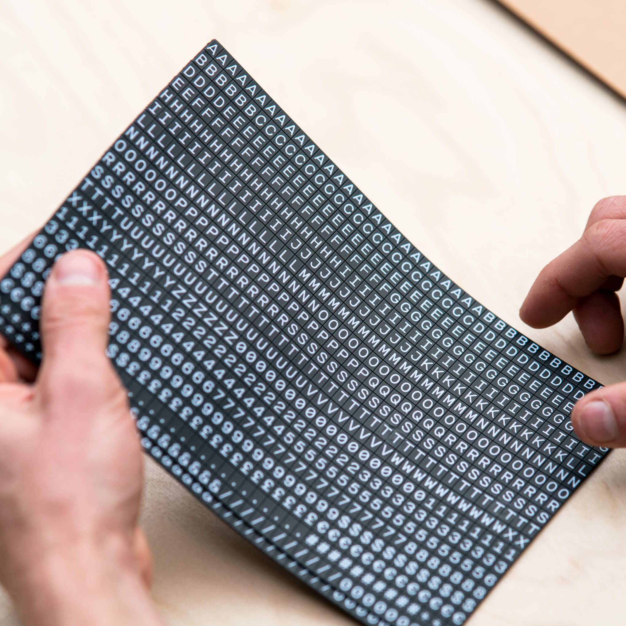 a photo of a sheet of the small magnet letters