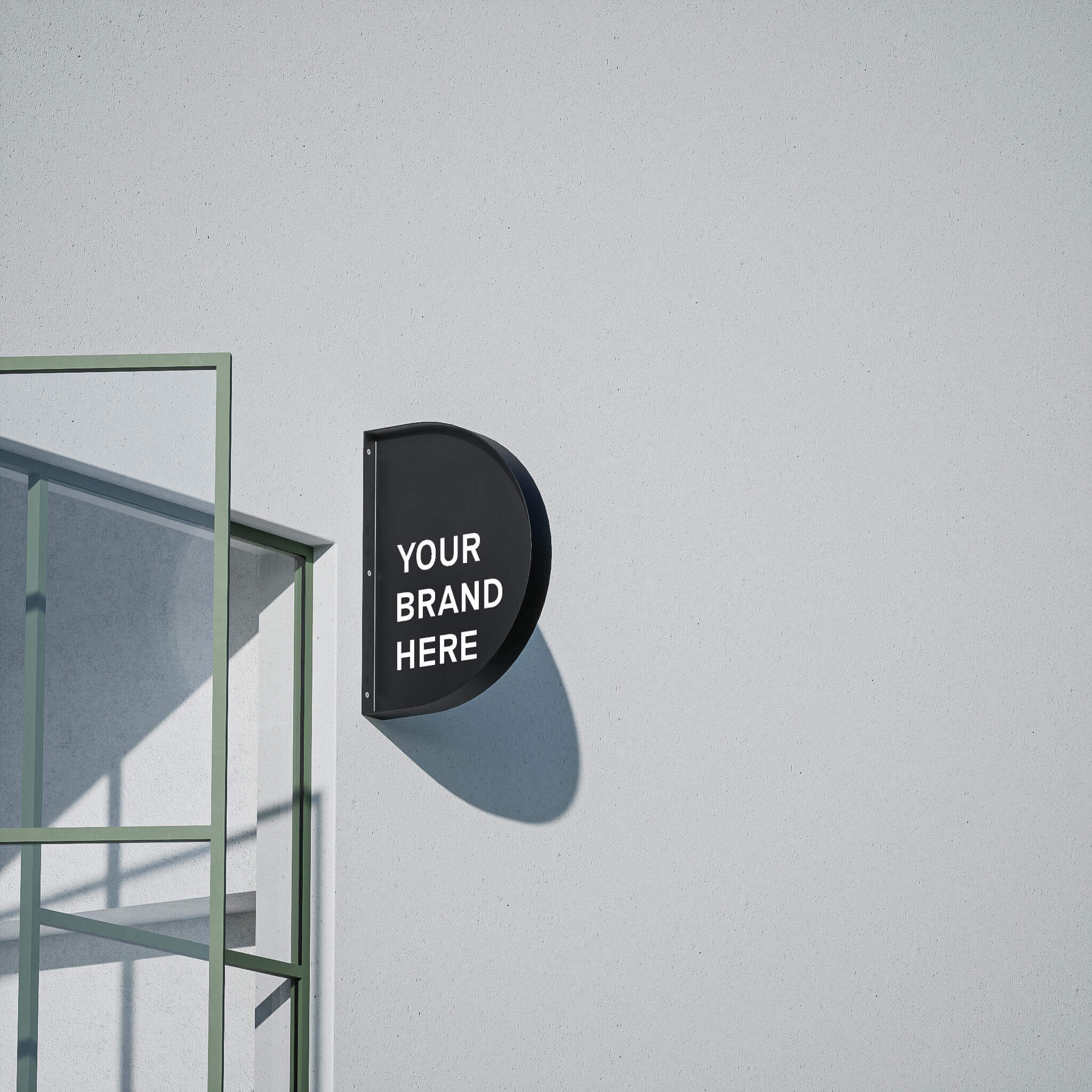 black half round wall-mounted store sign installed on a cement wall