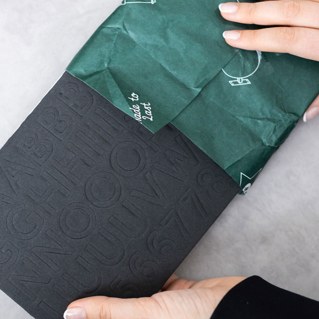 video of magnet letters being unwrapped from george & willy packaging