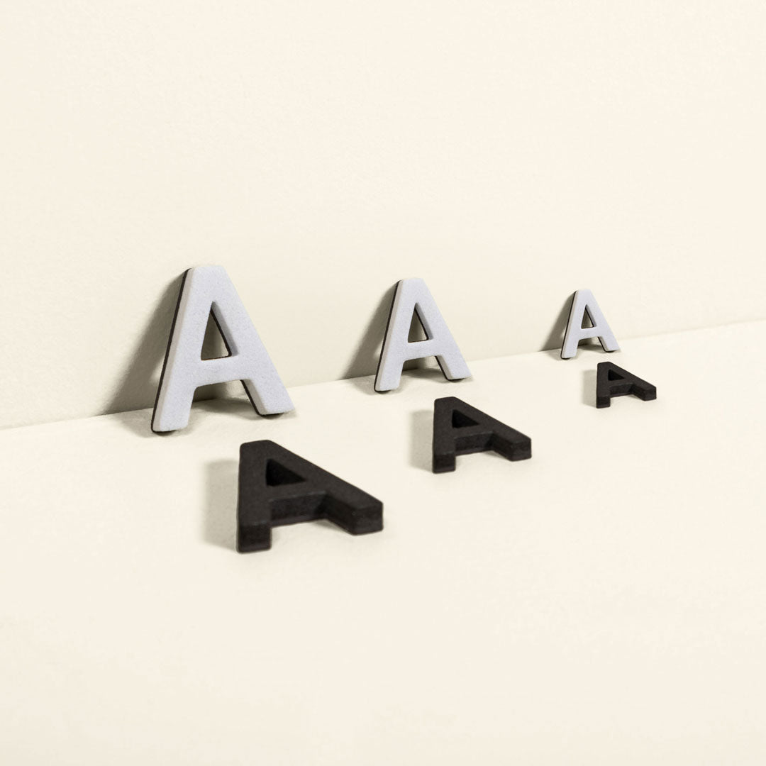the letter "A" shown in three different sizes in white and black beside each other