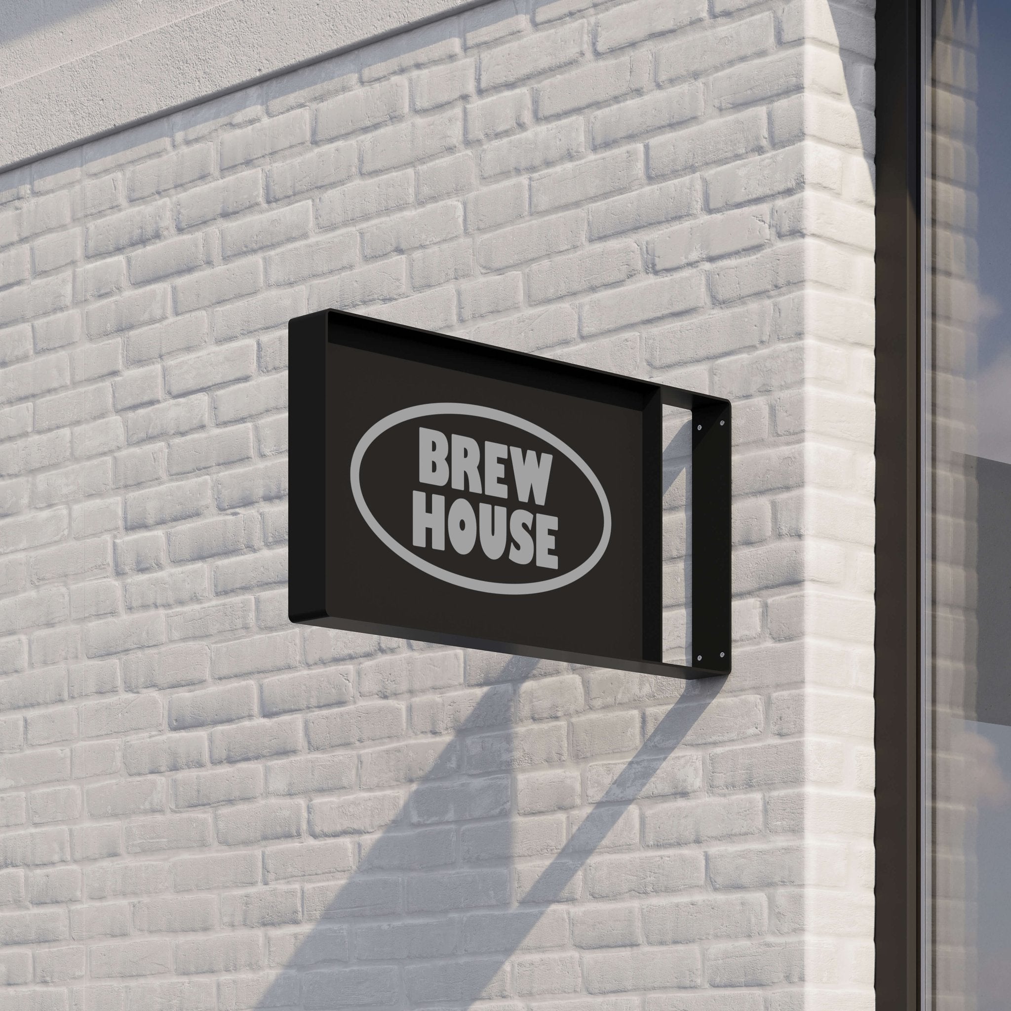 black rectangle blade panel sign against a brick facade