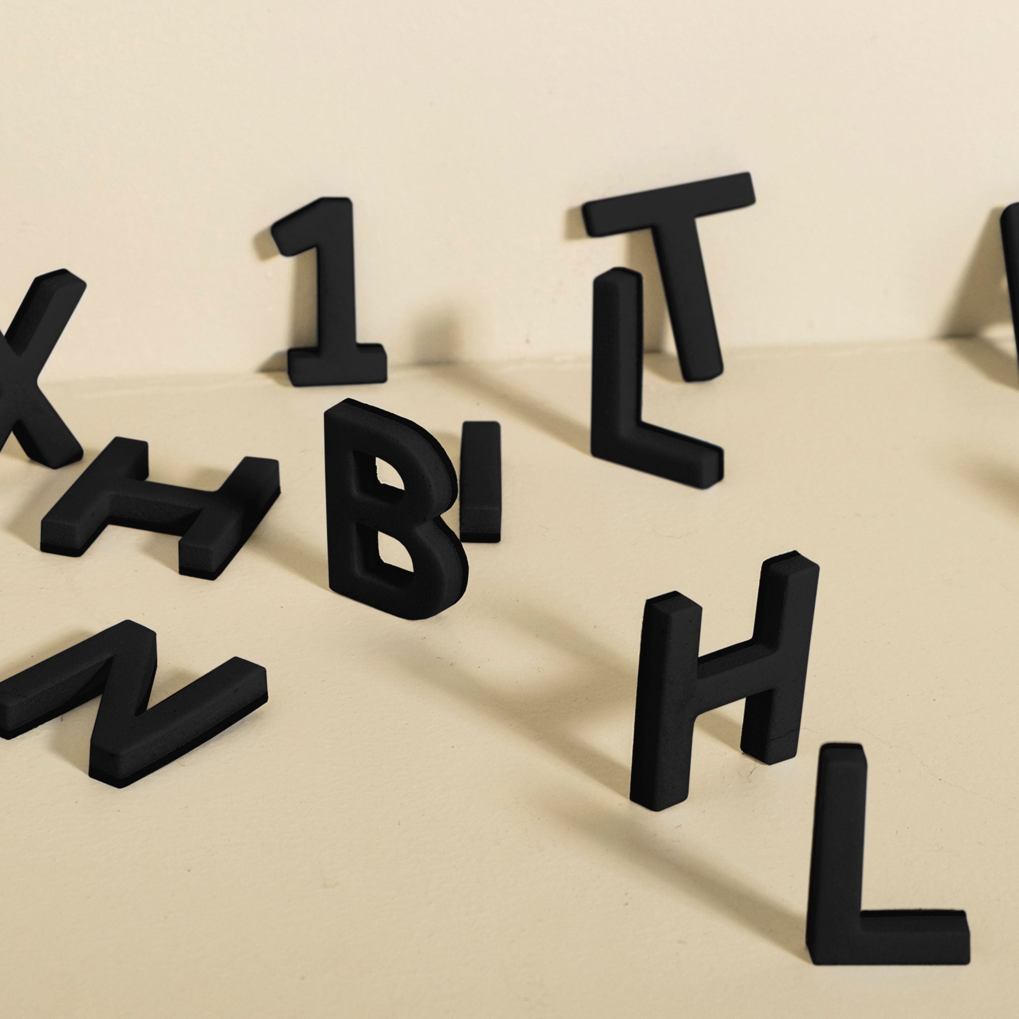 assortment of black magnet letters