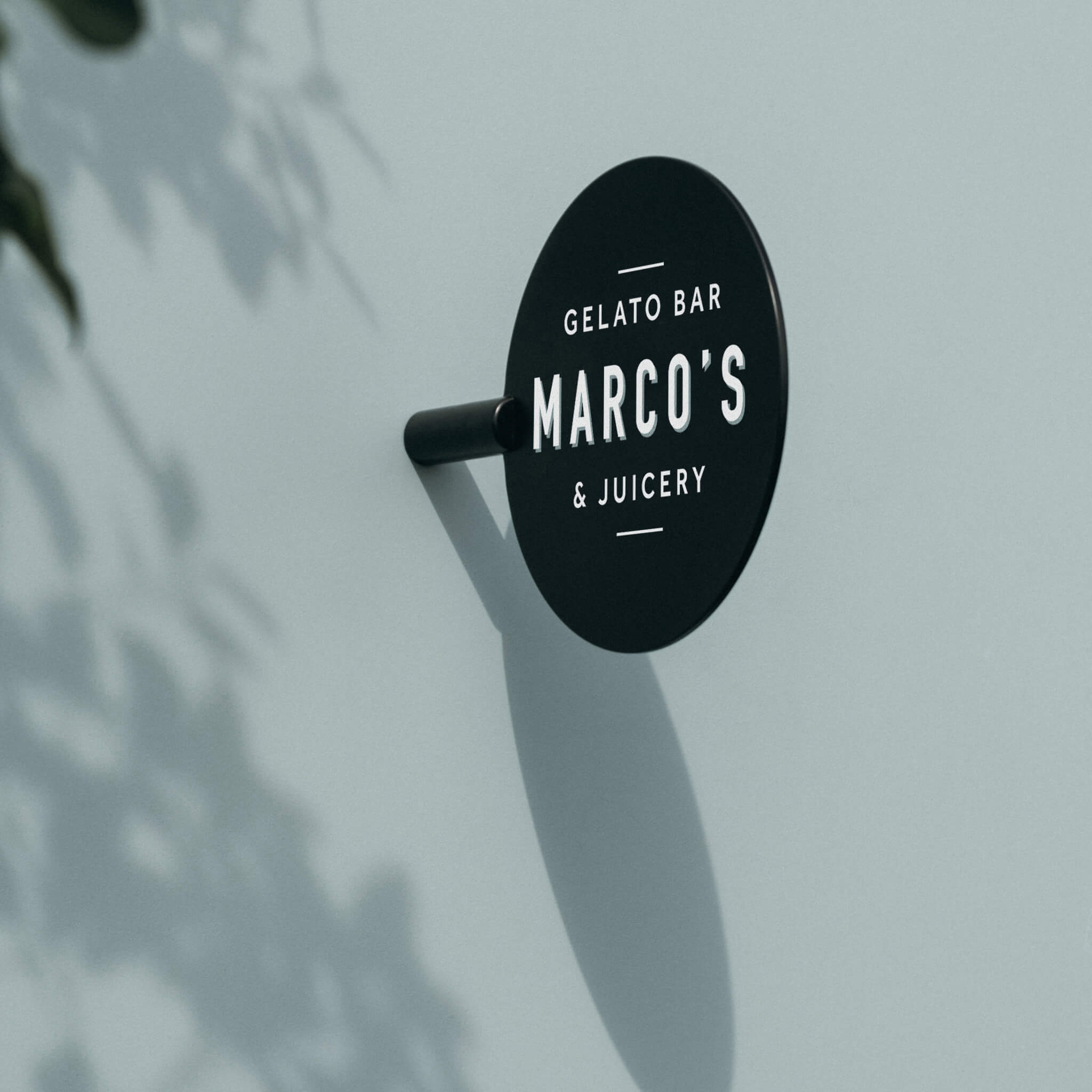 black circle sign installed on a wall
