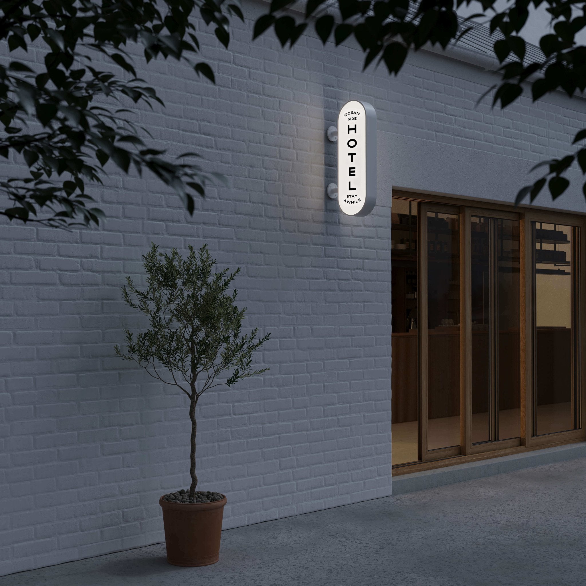 nighttime shot of the black curve lightbox sign with logo branding applied installed wall-mounted