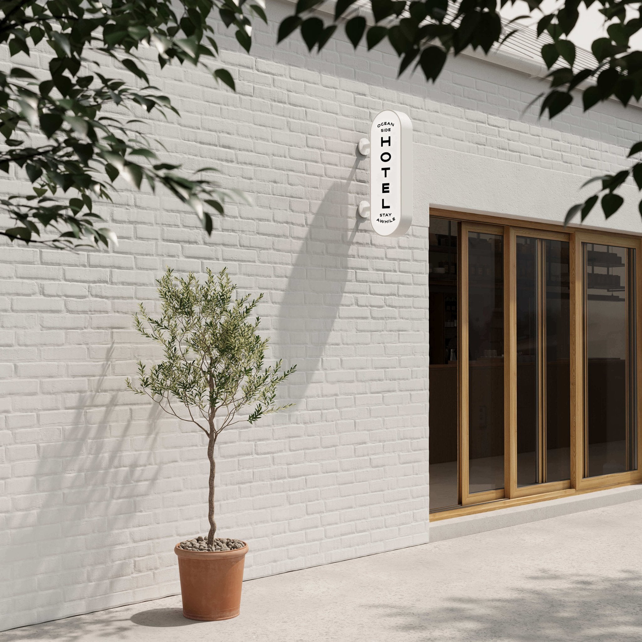 daytime shot of the white curve lightbox sign with logo branding applied installed wall-mounted