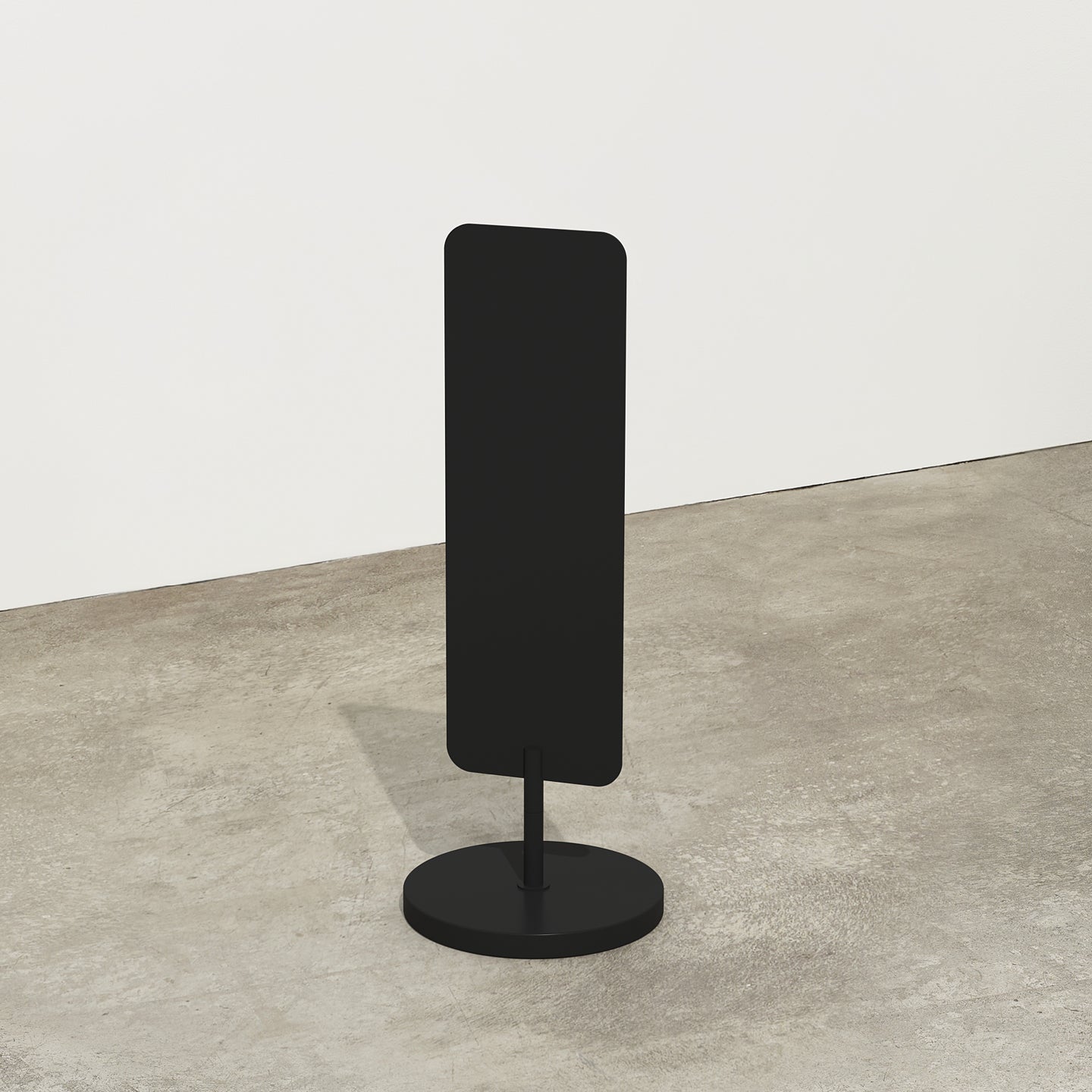 plain black large standing rectangle sign in a studio