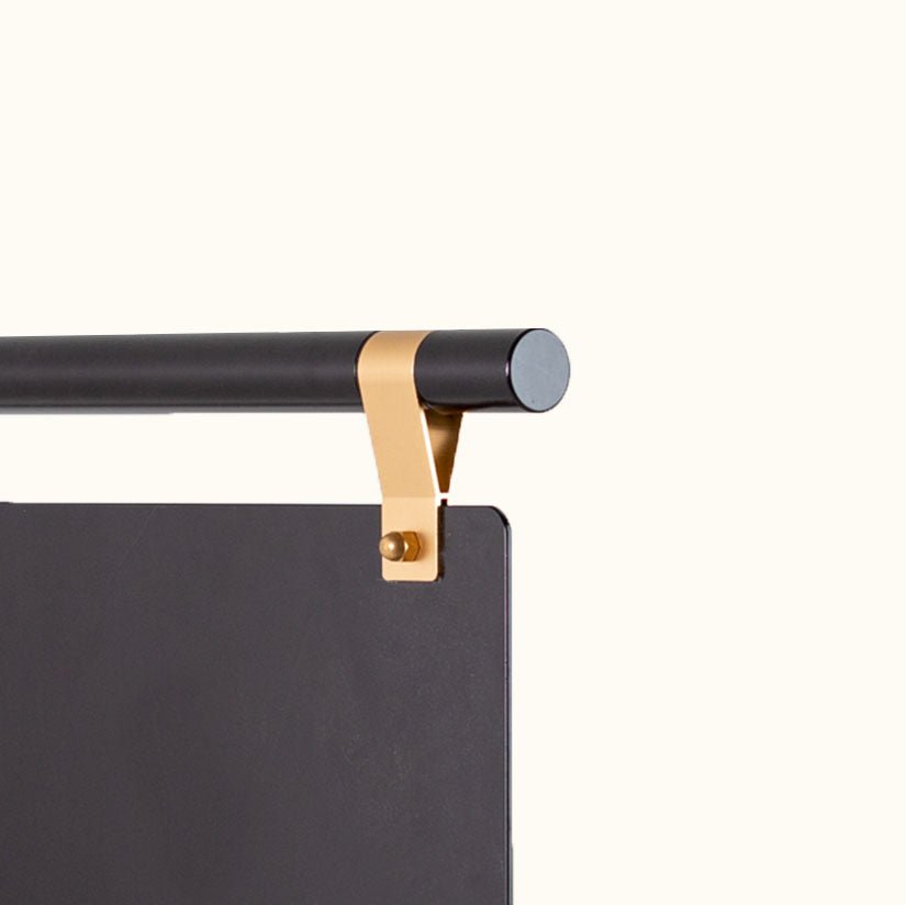 black store sign with brass detailing