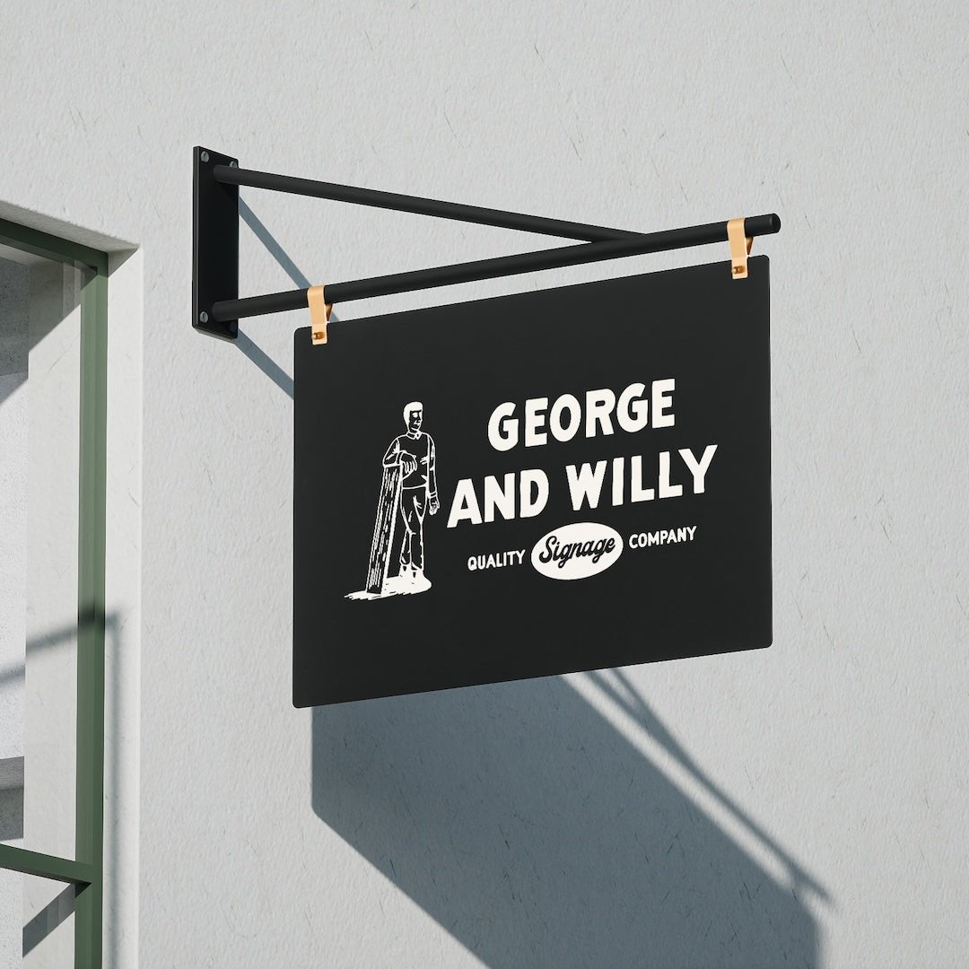 close up of large hanging shop sign with george & willy branding applied