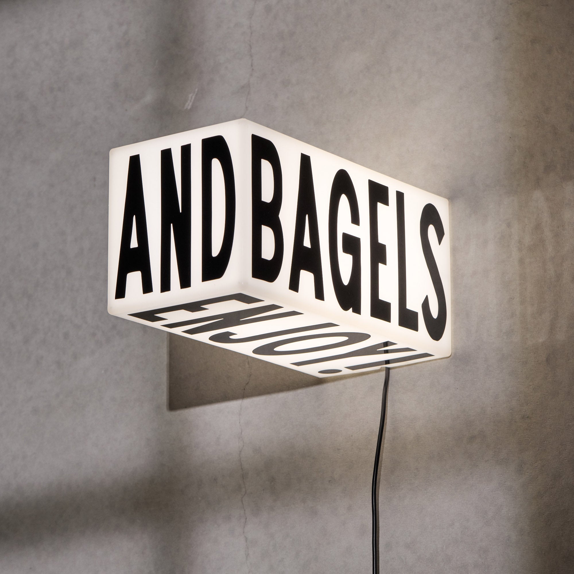 Rectangular plastic LED sign in matte white, unlit and photographed in studio setting