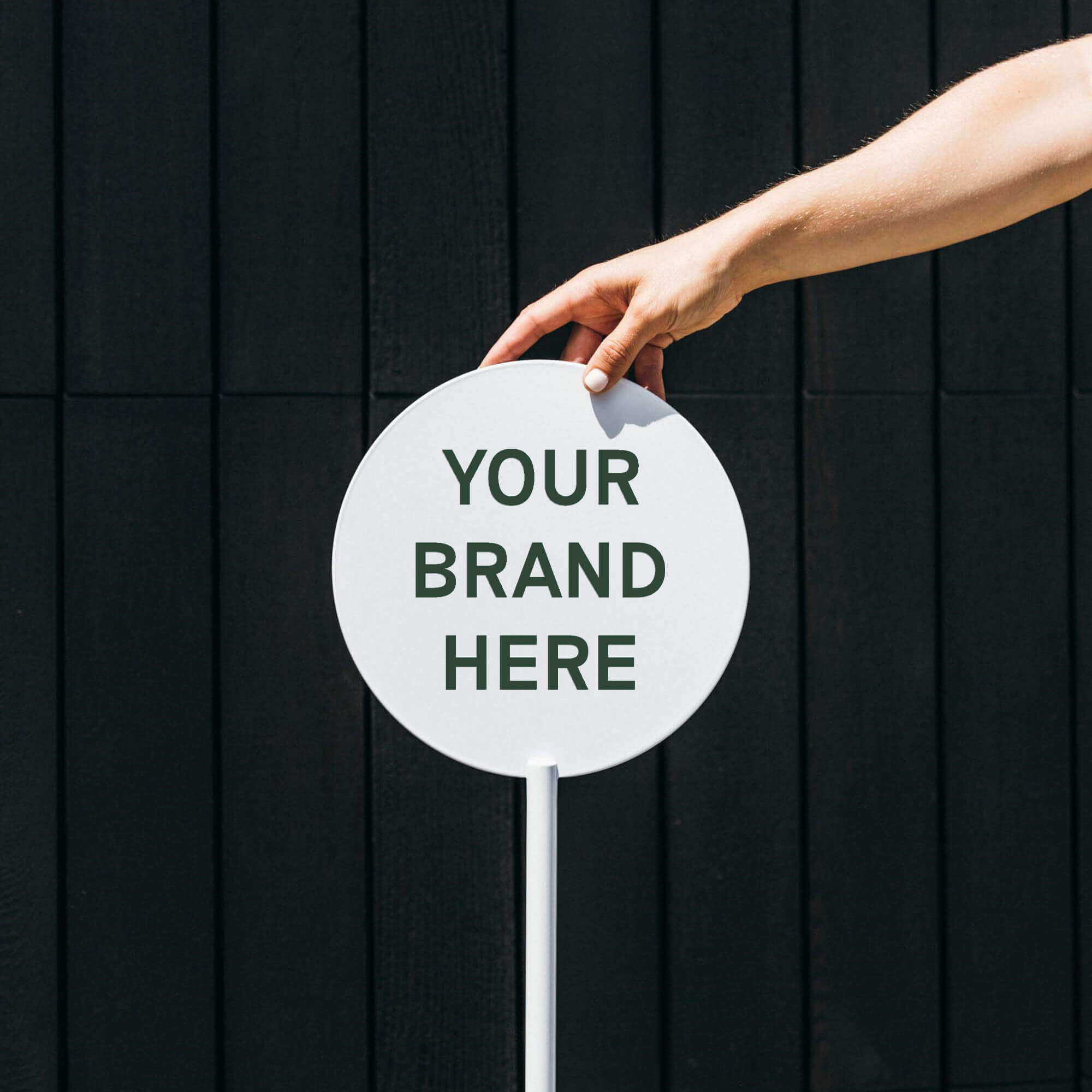 face panel of freestanding metal circle sign in white with logo