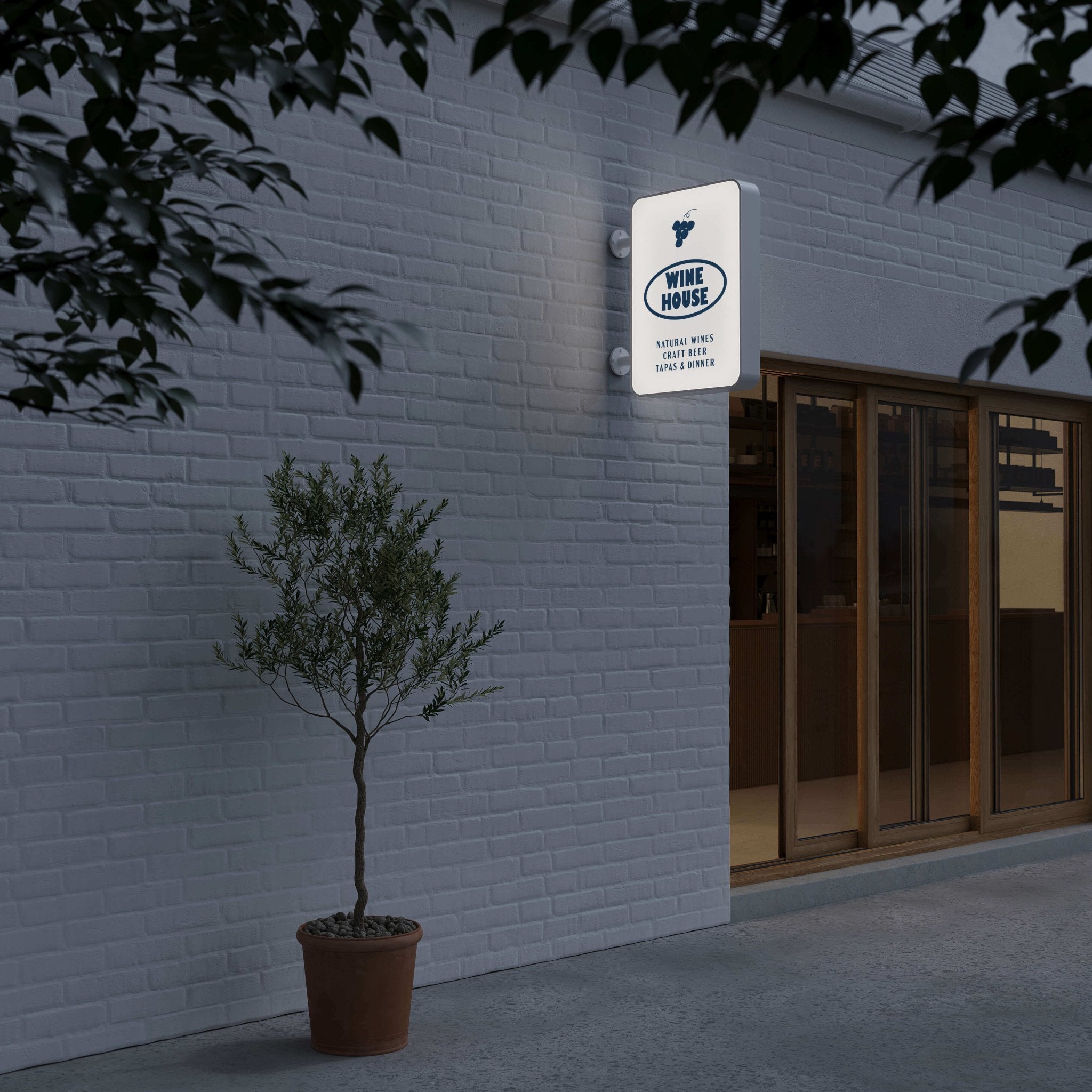 a nighttime shot of the lit-up rectangle lightbox illuminated sign installed on a storefront