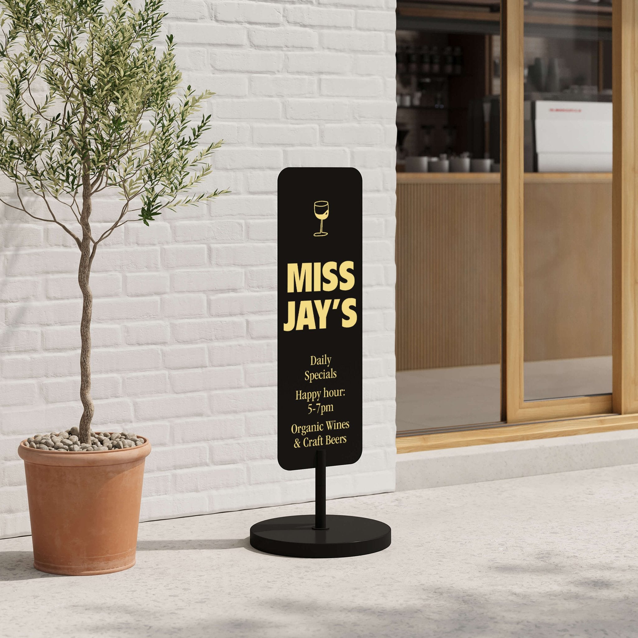 black large standing rectangle sign showing business logo standing in front of a storefront