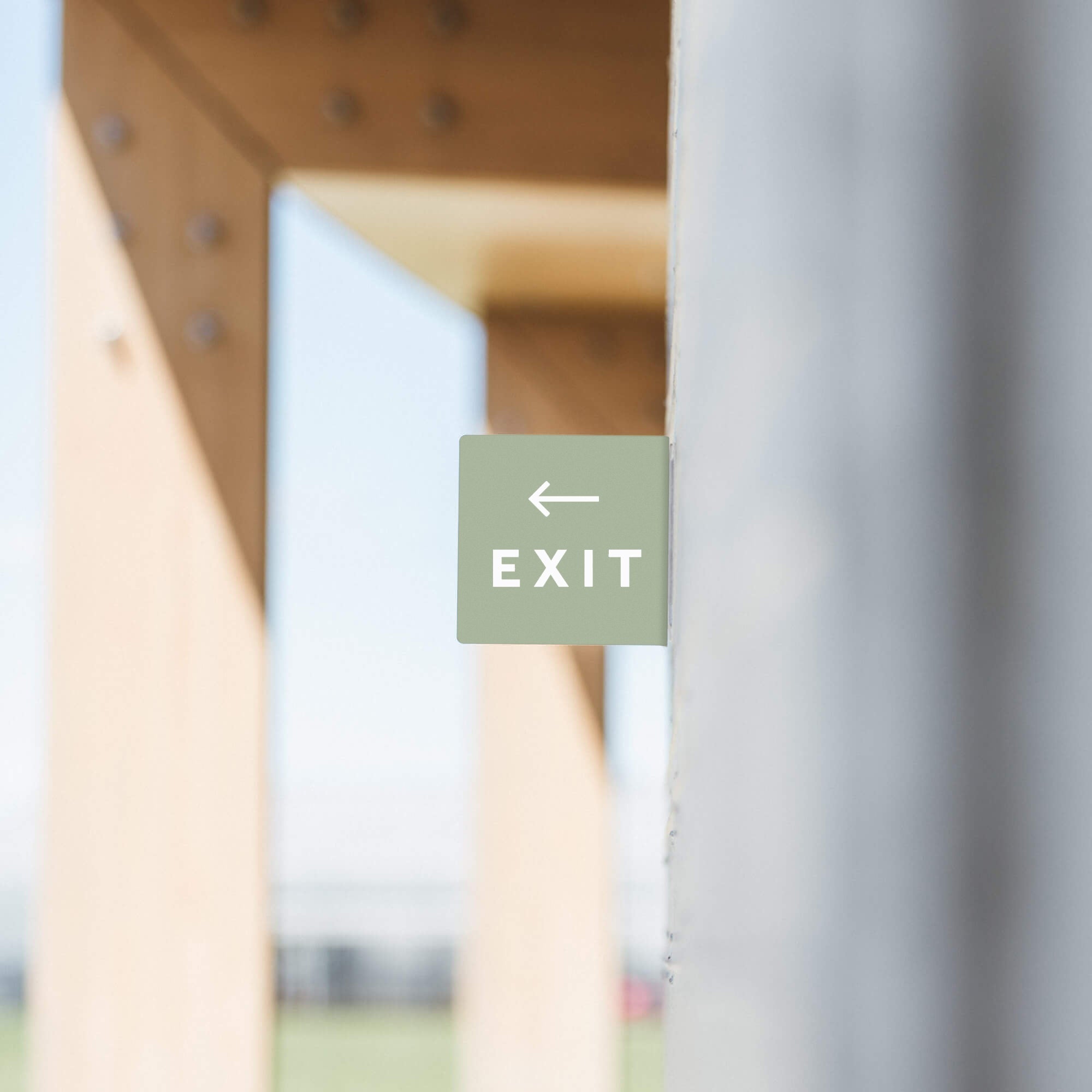 sage square blade sign with exit sign decals on