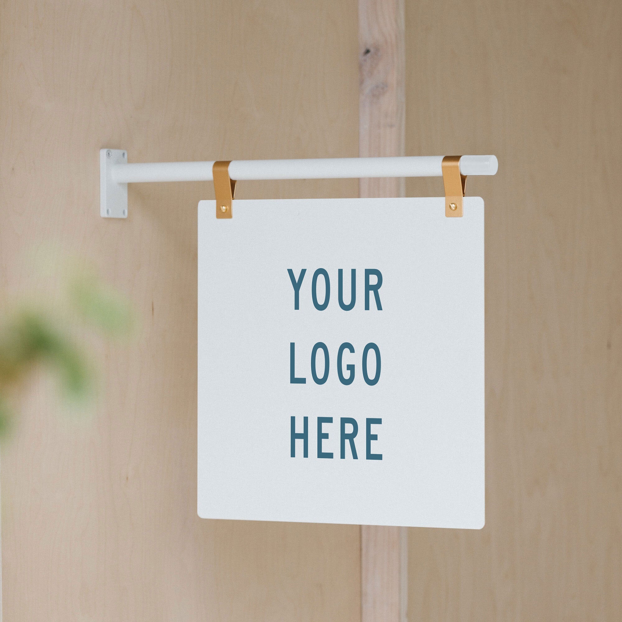 white metal hanging store sign installed as wall-mounted with "your logo here" printed on it