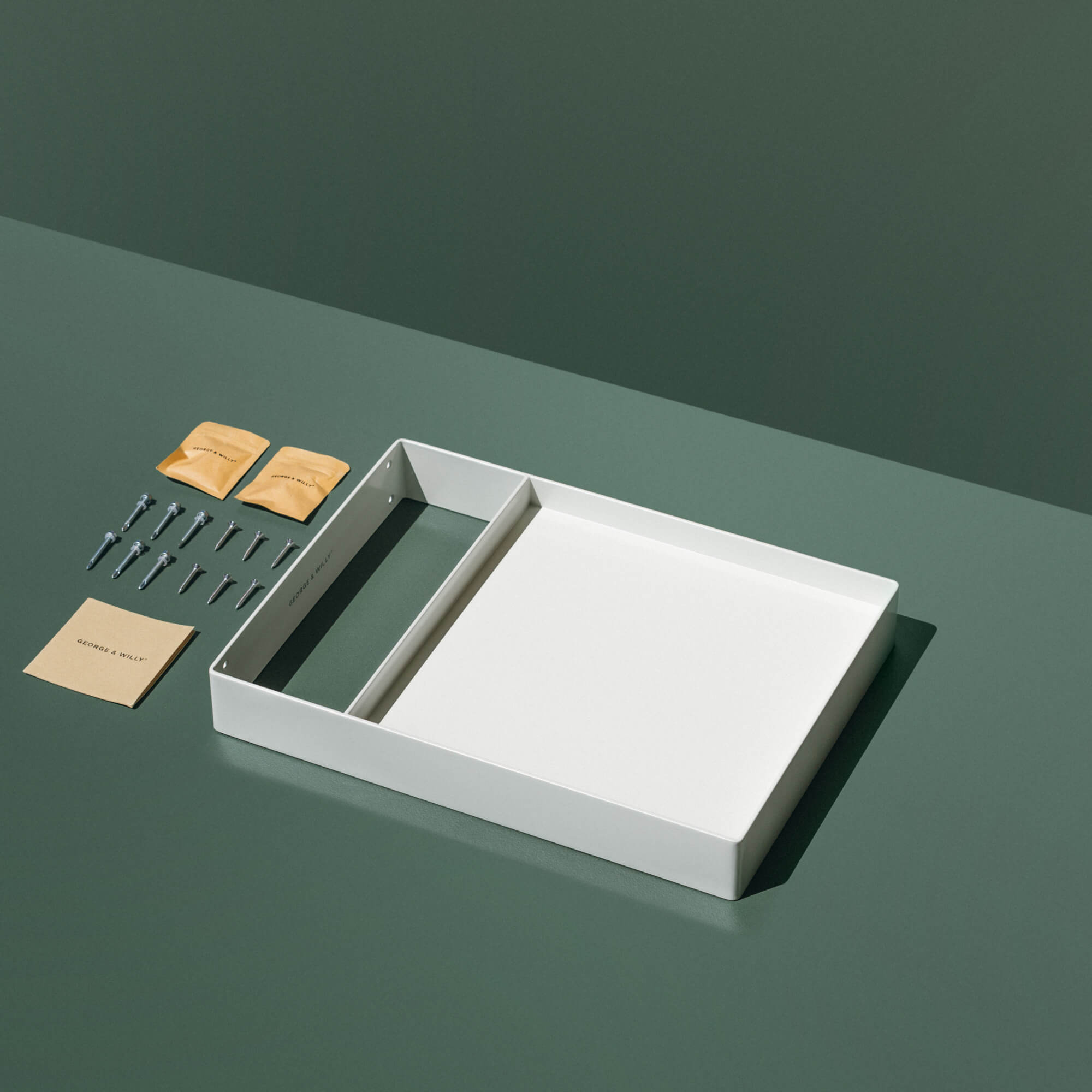 packaging contents laid out on green surface to show what's included in the store square panel sign